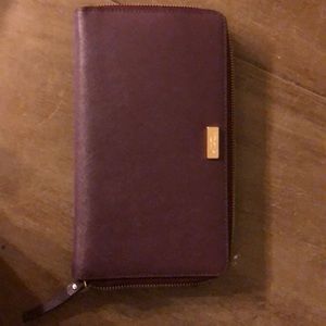 Kate spade travel wallet- wine/ burgundy in color.